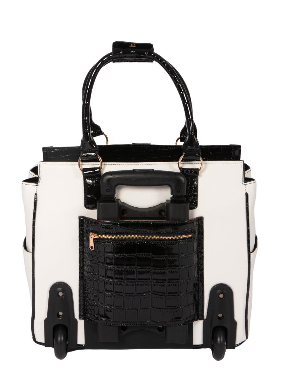 Back view of a wheeled work tote in white and black patent faux leather, featuring a retractable handle hidden in a zippered compartment providing easy access to chargers, phone, or passport. This rolling office bag for women is perfect for teachers, lawyers, or busy professionals on the go. Makes a great gift for working moms or travelers who need a rolling computer bag that’s both durable and elegant. Smooth-rolling all-terrain wheels make this the best women’s laptop bag for travel and work.