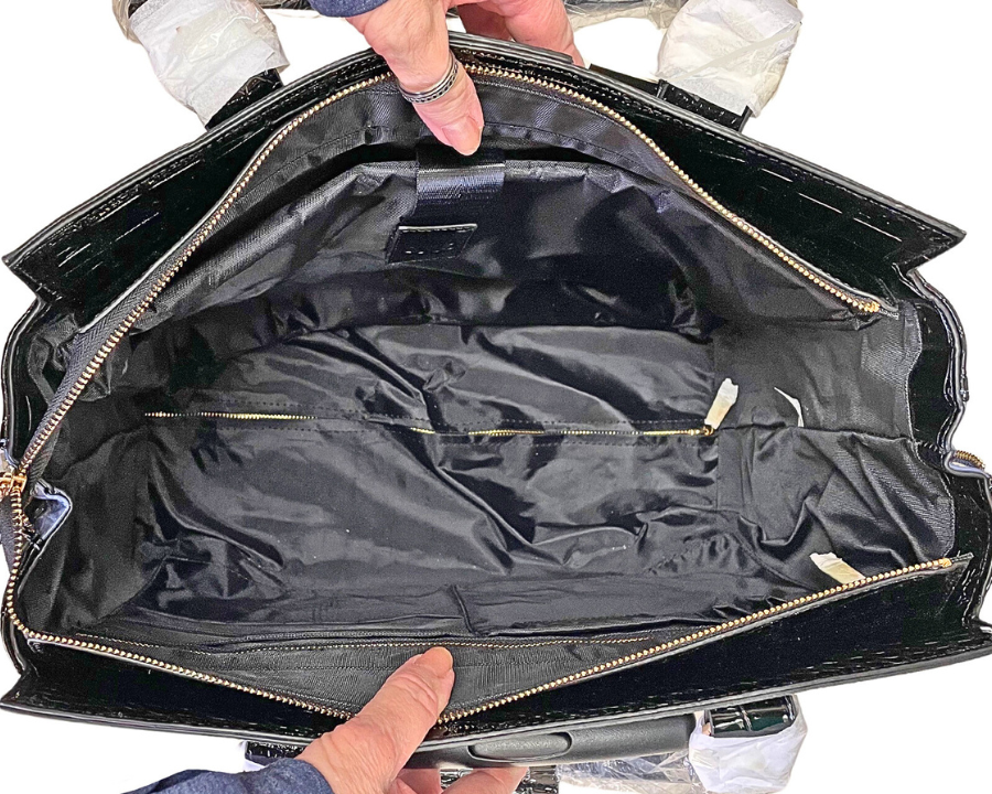 Interior of laptop office bags for ladies showing the ample space inside the bag for ladies laptop, exacompta ring binder, a4 project folder, plastic punched pockets, and small sellotape dispenser. Give the gift of fashionable colorful laptop bags!