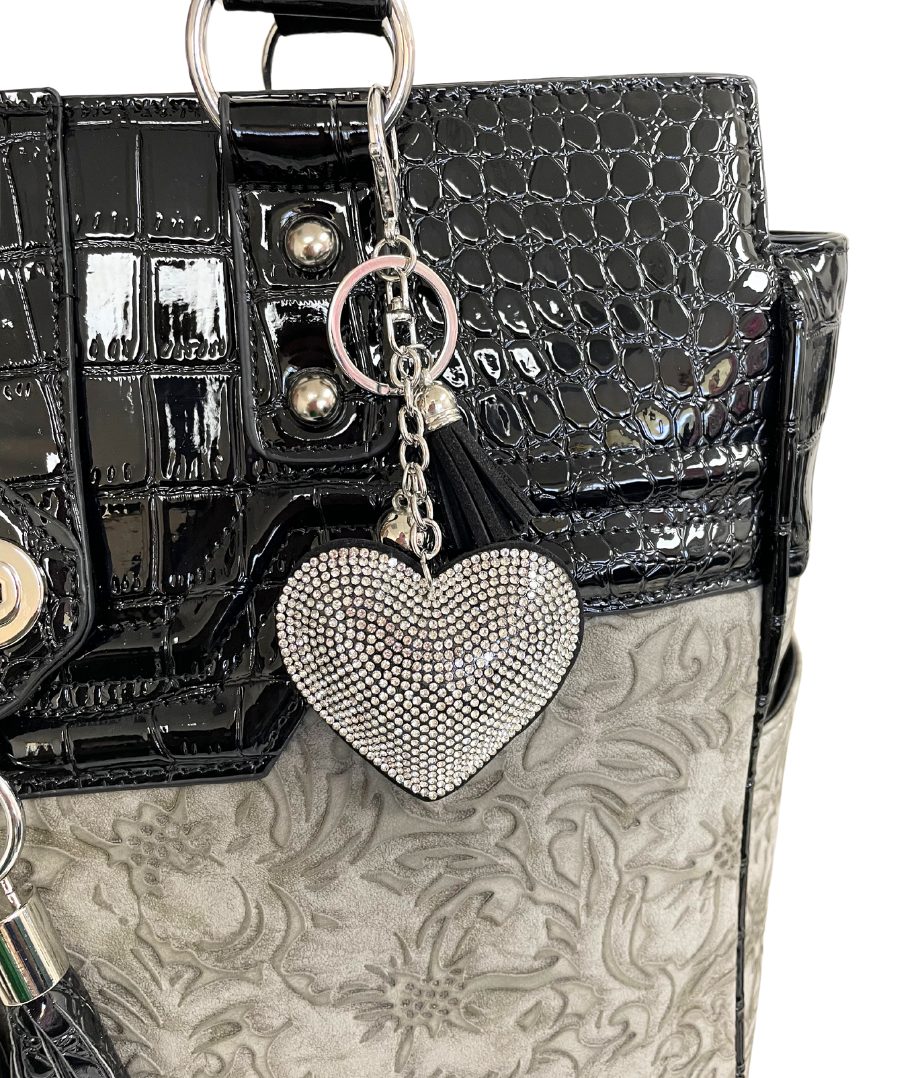A beautiful silver purse charm to decorate your work tote to show your style off! This heart purse charm is the perfect keychain accessories for women and can be used as a clip on backpack charm.