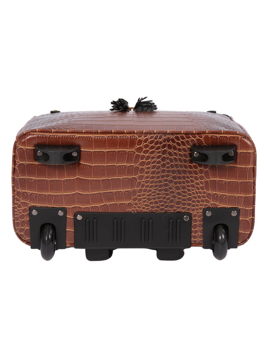 Bottom view of the brown crocodile embossed rolling laptop bag with two inline back wheels and two front feet to keep the bag ff the ground and prevent it from tipping over when letting go of the handle.