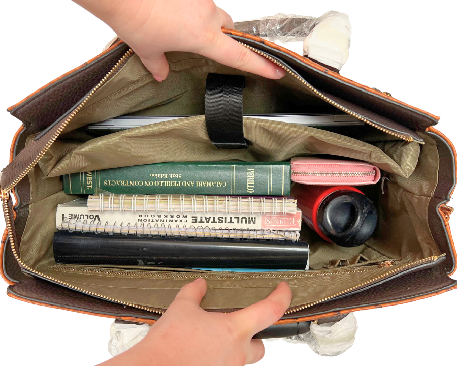 A water bottle, wallet, notebooks, workbooks, textbooks, laptop, and charger sit nicely in the spacious interior of the briefcase on wheels for women. This bag can also hold travel essentials like cute travel clothes, comfy travel shoes, sleep mask, toiletry kit, and makeup bag.