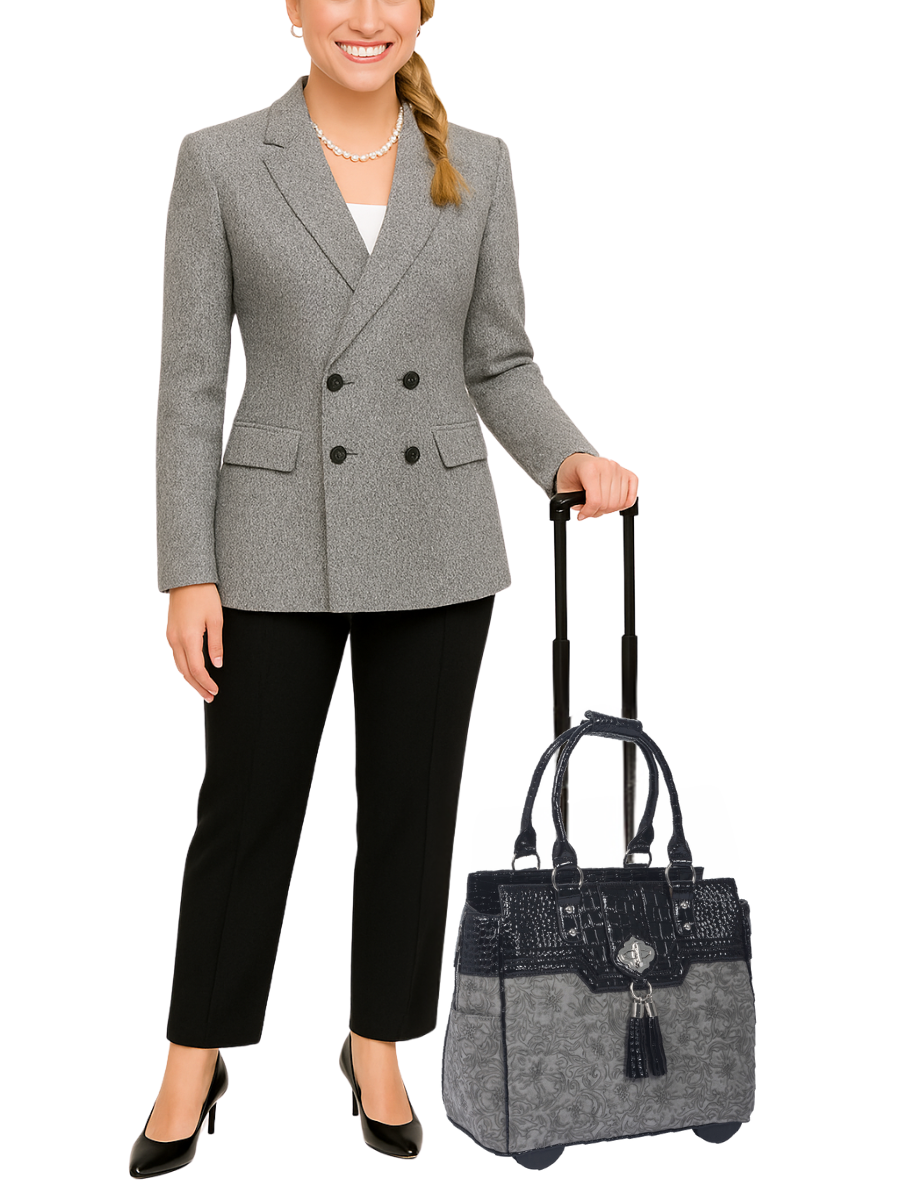 A woman poses with her gray briefcase on wheels for women with a floral pattern. She wears business casual attire to match the professional style of her bag. This tote bag with wheels can be used for work, travel, shopping, or everyday errands. She can comfortably take her rolling laptop bag with wheels on public transport. This gray tote bag with wheels is ideal as a birthday gift for professional women or women on the go. It is also perfect as a weekender travel carry on bag for weekend trips.
