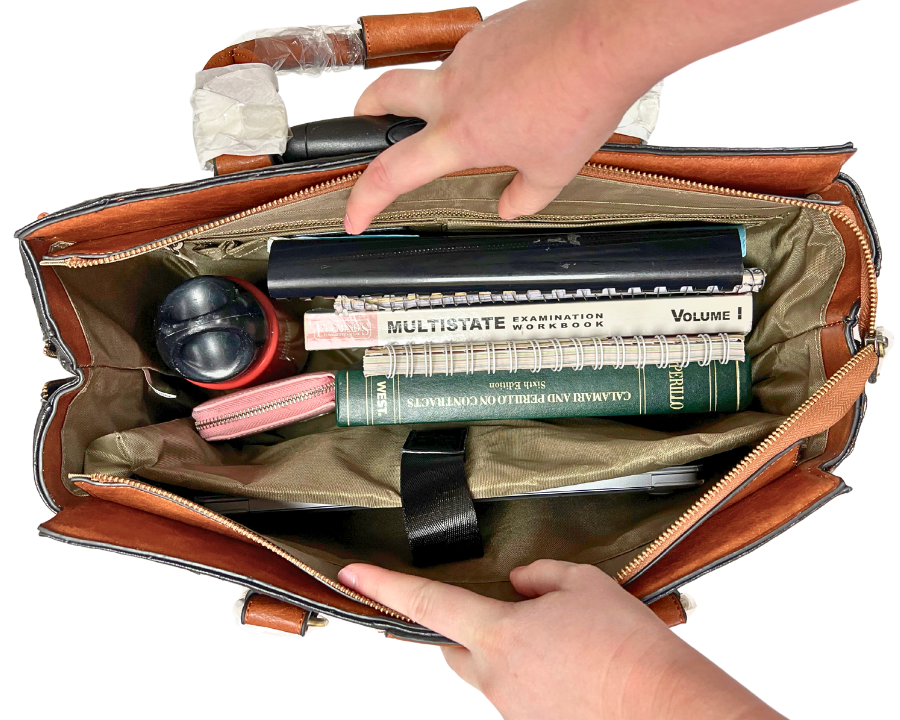 Work and travel essentials for business trips, work travel, daily commutes, weekend adventures, and girls trips fit easily in the A-List rolling weekender for women. Shown here are work must haves for the office such as notebooks, textbooks, laptop, chargers, wallet, and water bottle.