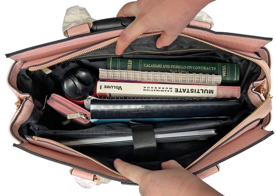 An interior image of the pink work bag, an alternative to other laptop bags such as the lovevook laptop bag for women. This coquette briefcase for women is fashionable and functional and will safely hold your valuables as you commute to the office.