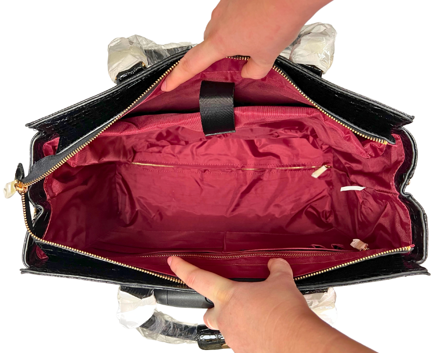 Empty spacious interior of the bag featuring an interior pouch and an interior zipper pocket for easy organization. This lightweight bag is ideal for carrying essentials like an Apple laptop and is comparable to stylish 31 bags.
