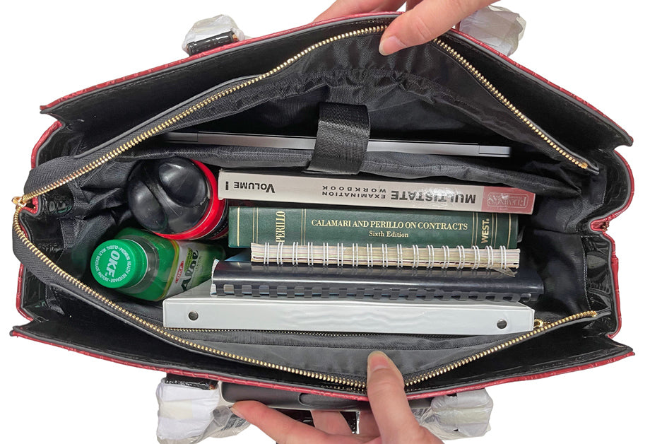 Interior of the maroon bag as an example of the various items that can be stored in it. This bag holds work supplies but it can also be used as travel bag for weekend trips or business travels. It can hold work attire, work heels, and toiletry bags. The perfect mobile workstation for teachers, nurses, and students who need to keep everything in one place while avoiding the strain of traditional shoulder bags. Thoughtful gift idea for a graduate, busy mom, corporate boss babe, teacher, or lawyer.