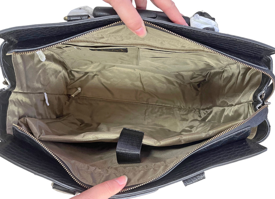 Interior view of The Firenze, highlighting its spacious design, padded laptop sleeve, and multiple pockets, including a large zipper compartment. Ideal for organized professionals, with ample space for work and travel essentials.