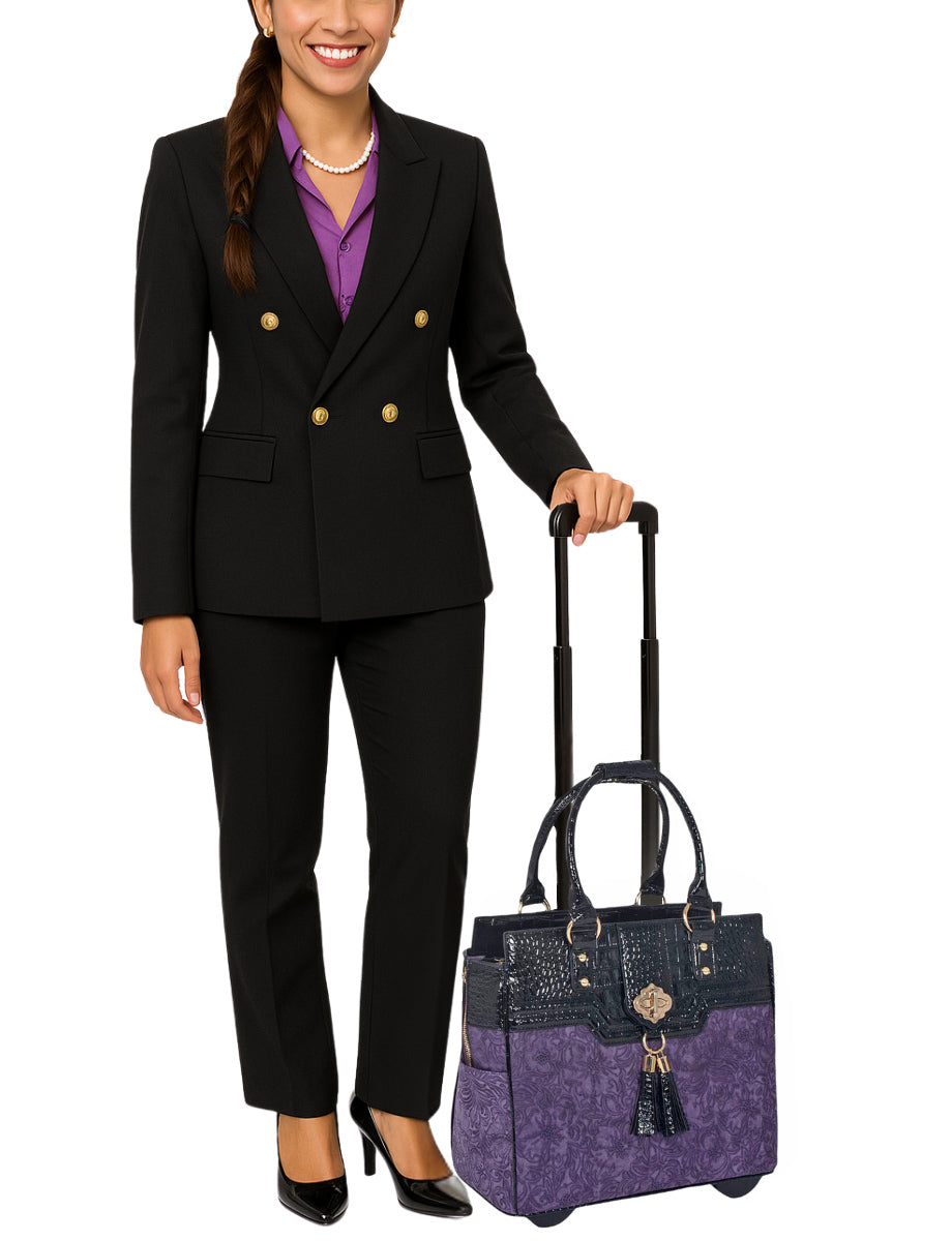 A stylish woman in cute professional clothes stands with the Contessa rolling laptop tote at her side, exuding confidence and elegance. With its rich floral purple pattern and croc accents, this women’s work bag with wheels is perfect for fashion-forward professionals. Whether used as a travel laptop bag or a business tote with a padded compartment, it’s the perfect combination of beauty, utility and personality for busy days and boardroom meetings. Also makes the perfect gift for mom or friend.