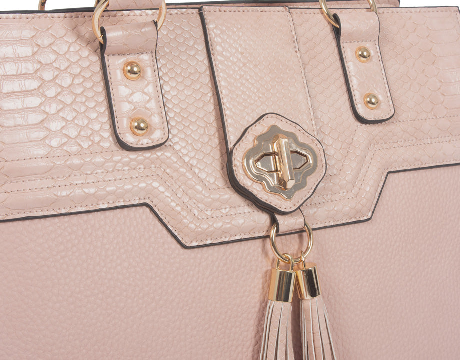 An up close image of a briefcase rolling laptop bag. This work bag for women is used to carry work essentials such as notebooks and journals, phone, wallet, headphones, chargers, cords, lunch bag, pens and pencils, glasses, water bottle, and more!