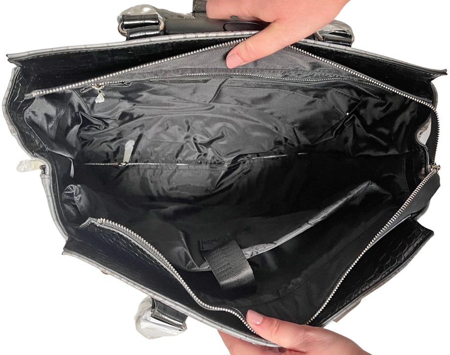 Interior view of the jkm & company rolling laptop bag women that can be filled with work and travel essentials. The spacious design includes compartments for a laptop, notebooks, pens and more, offering a sleek and organized solution for female computer bags.