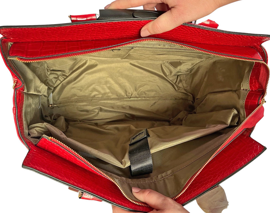 One of the top must haves holiday essentials or bag essentials for travel, there is ample room in this red bag for everything on your holiday suitcase checklist! Fit trip supplies, carry on bag essentials, travel outfits, and a travel journal inside!
