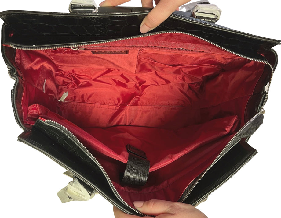 Spacious interior of a women’s roller briefcase featuring a padded laptop sleeve, large zippered compartment, 4 organizational pockets, and 2 pen holders. Perfect for work essentials, combining style with functionality. The interior fabric is red.