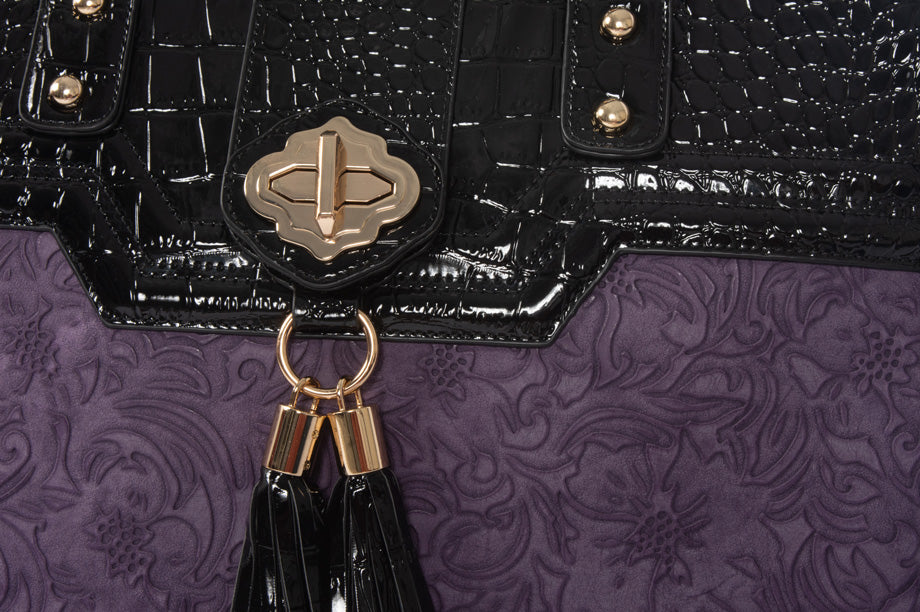 Close-up view of a purple rolling briefcase laptop bag, highlighting its high-quality materials and craftsmanship. The vibrant flower pattern and sleek black alligator fabric show the bag’s elegance, making it a stylish gift for professional women.