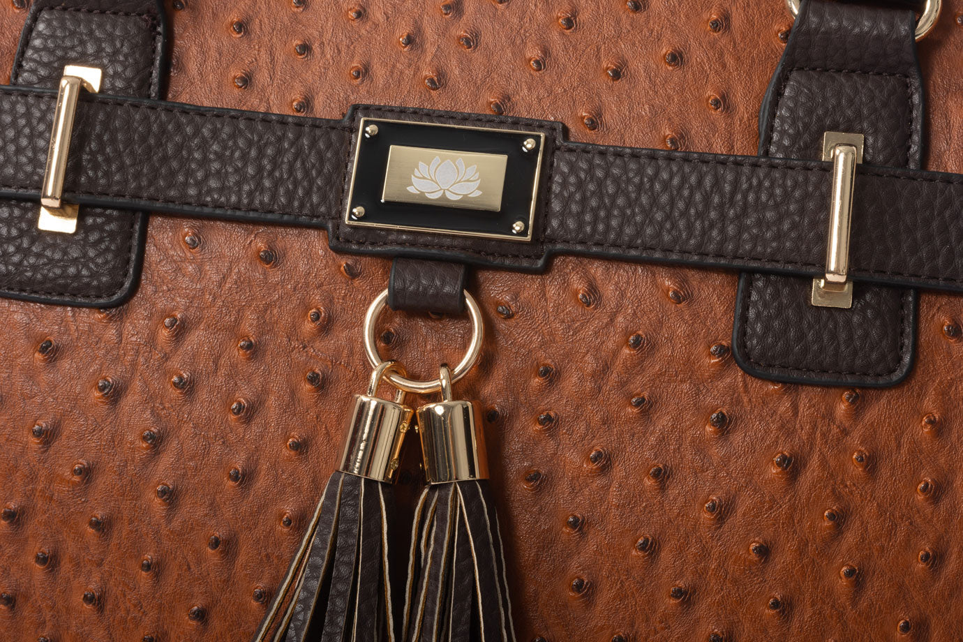 Close-up of a cognac faux ostrich leather bag showcasing its impressive craftsmanship, high-quality fabrics, and elegant metalwork. A stylish alternative to Dooney and Bourke handbags, perfect for women seeking tote bags with both function and flair.